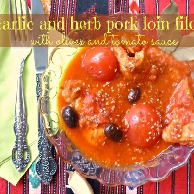 Garlic and herb pork loin filet with olives and tomato sauce