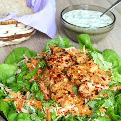 Yummy and healthy spicy chicken salad with root vegetables and yogurt mustard sauce