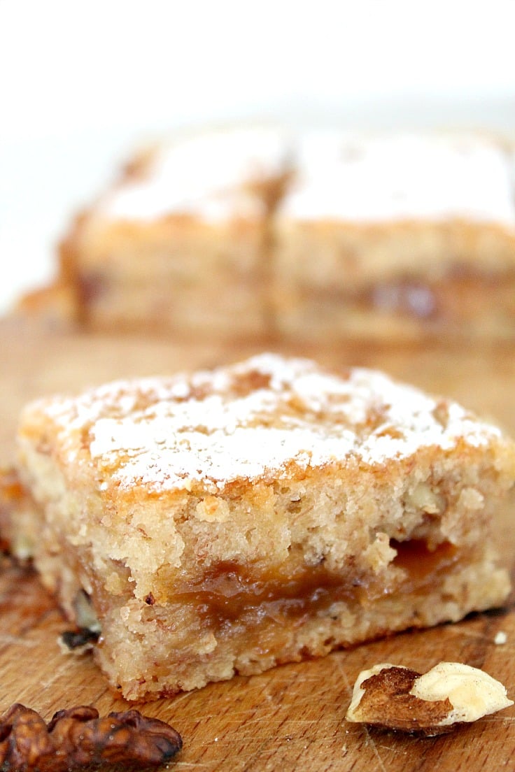 Banana blondies made with bananas walnuts and caramel sauce and cut into bars