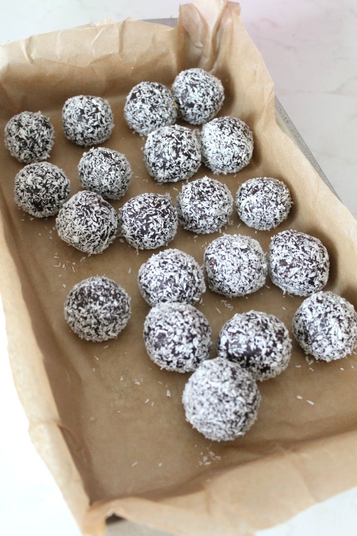Roll balls through coconut flakes