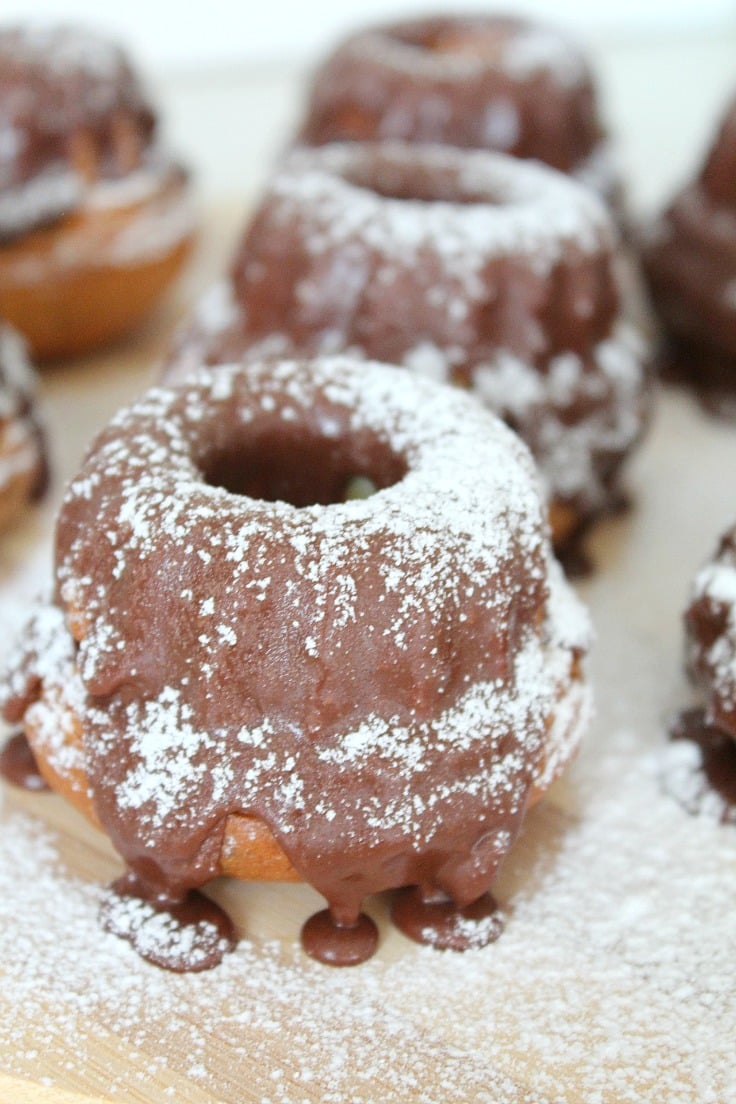 These Mini Orange Bundt Cakes are so cute and lovely! Full of orange flavor and glazed with chocolate, these make an amazing festive dessert!