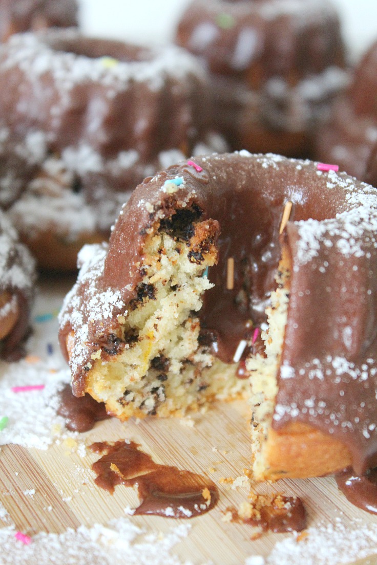 These Mini Orange Bundt Cakes are so cute and lovely! Full of orange flavor and glazed with chocolate, these make an amazing festive dessert!