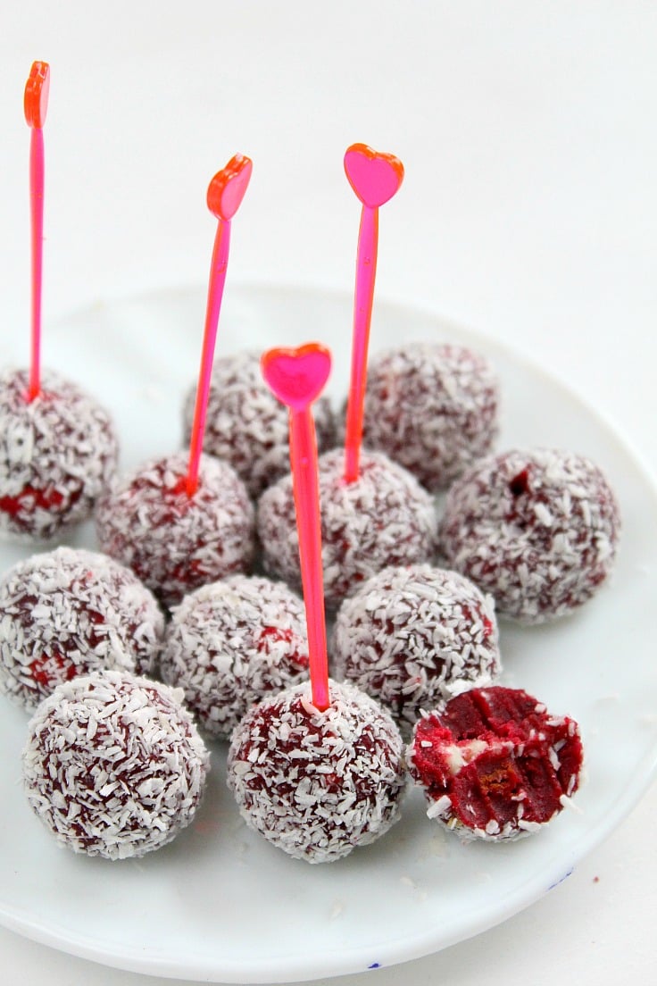 This recipe is perfect not only for Valentines but any holiday. These moist red velvet cake balls recipe with coconut and white chocolate bits are festive, sweet and make a wonderful indulgent treat or gift!