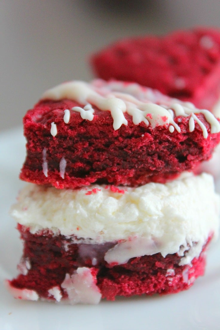 This mini sandwich cake recipe has two layers of red velvet cake and a delicious coconut cream cheese filling for the ultimate Valentine's Day dessert!