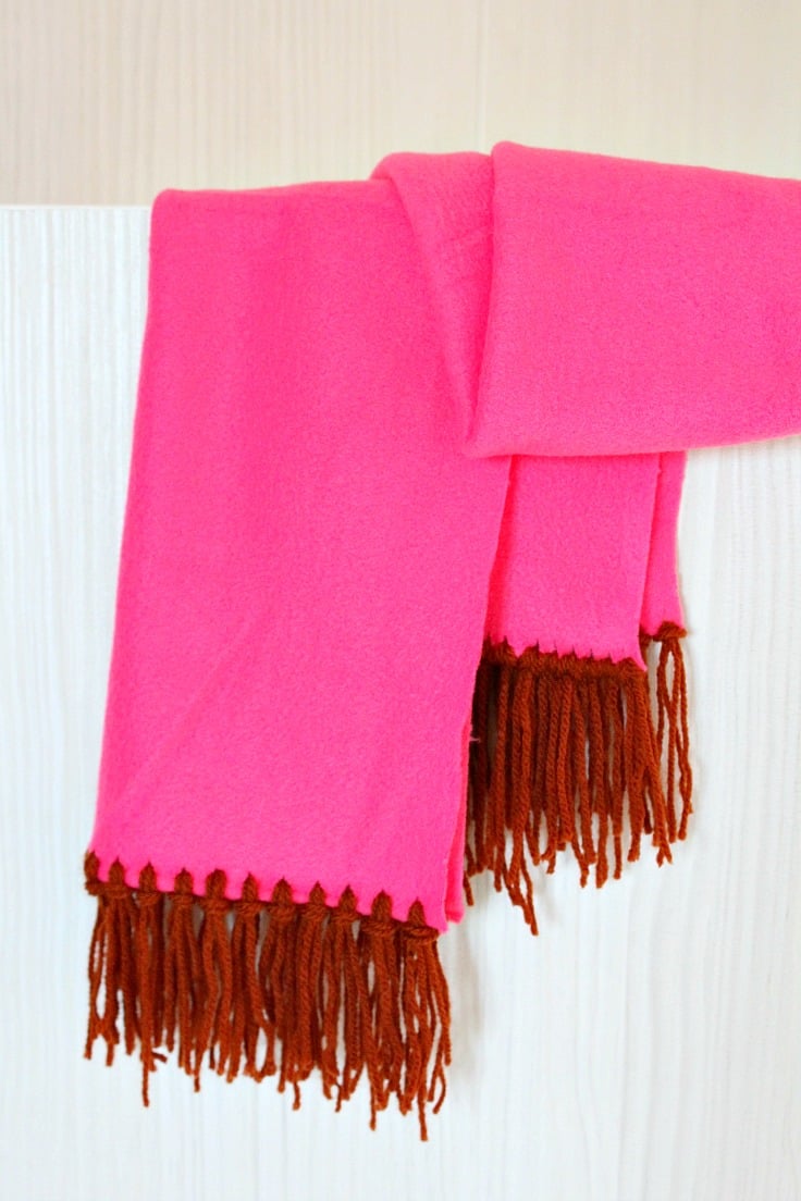 No Sew Fleece Scarf in pink fleece with fringe made from brown yarn