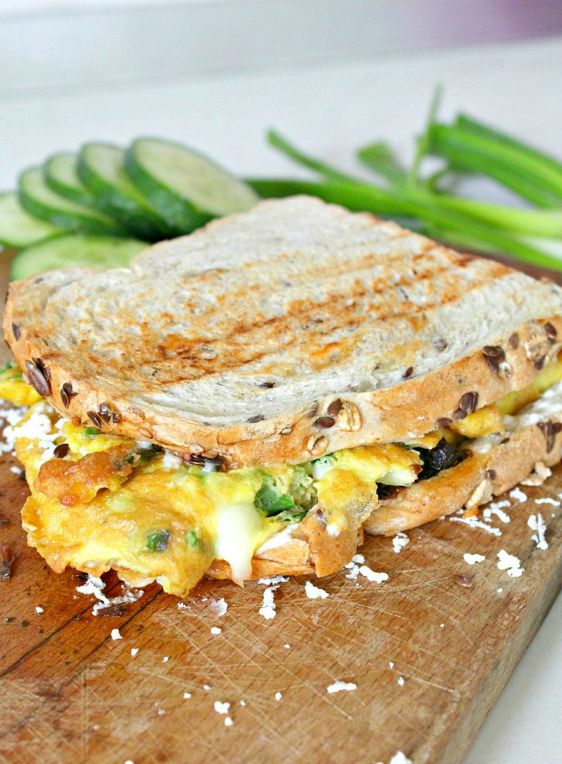 Omelette Sandwich With Sun Dried Tomatoes, 3 Cheeses & Green Onions