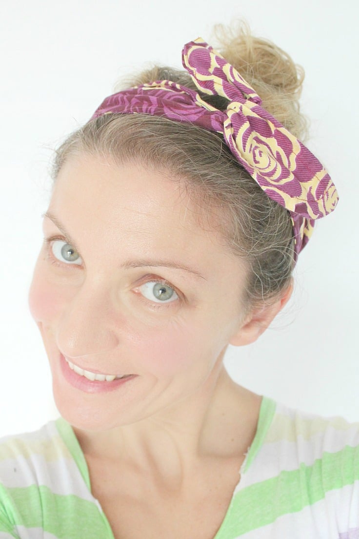 Image of a woman wearing a DIY wire headband in purple and light yellow. 