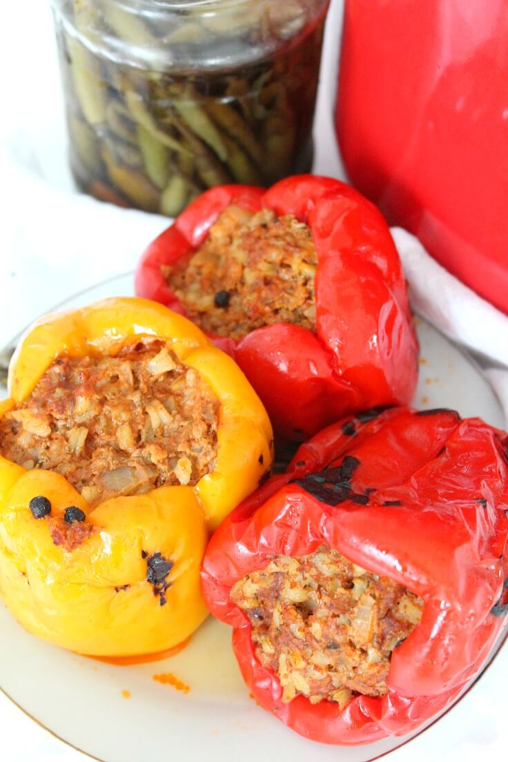 Roasted stuffed peppers made with red and yellow bell peppers, filled meat and rice