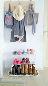 Upgrade an old boot tray with this DIY shoe storage! Perfect for snowy boots, this front door shoe storage idea will completely change the look of your entryway!
