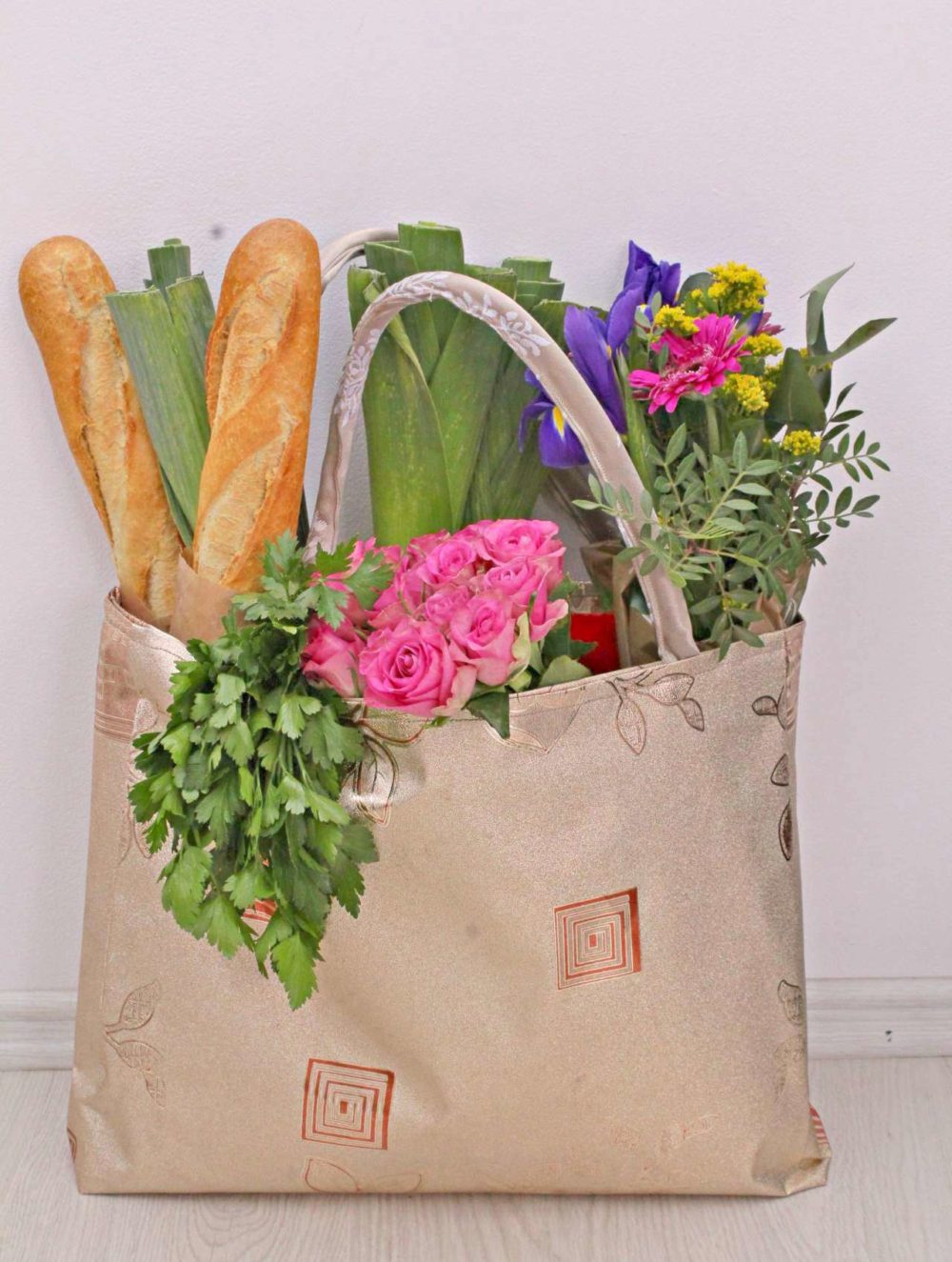 Grocery bag pattern for a reusable tote bag that is made out of vinyl, is reversible, sturdy, roomy and durable.