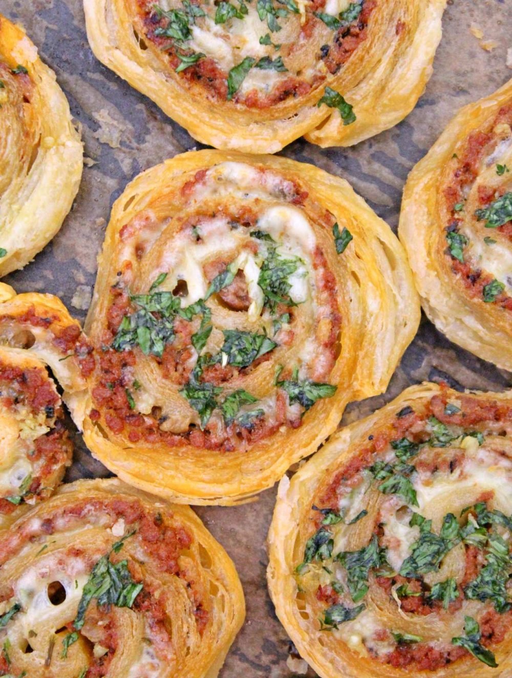Great as finger food for parties, a yummy snack or a meal on the run, these meat pinwheels are super easy to make and insanely delicious!