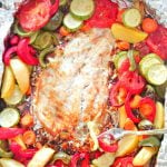 Fish that is baked in the oven in aluminium foil, together with vegetables, garlic and lemon juice