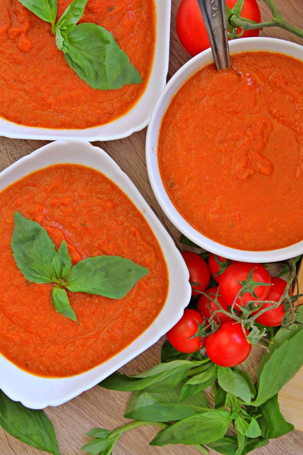 easy tomato basil soup in white bowls