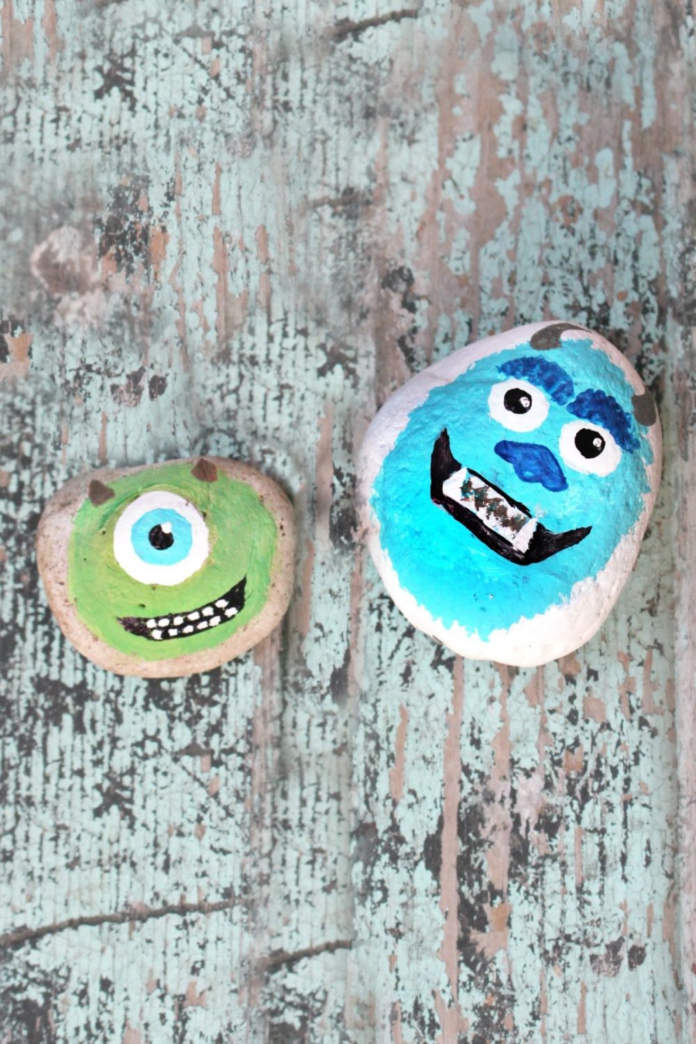 Monster painted rocks on a wood table