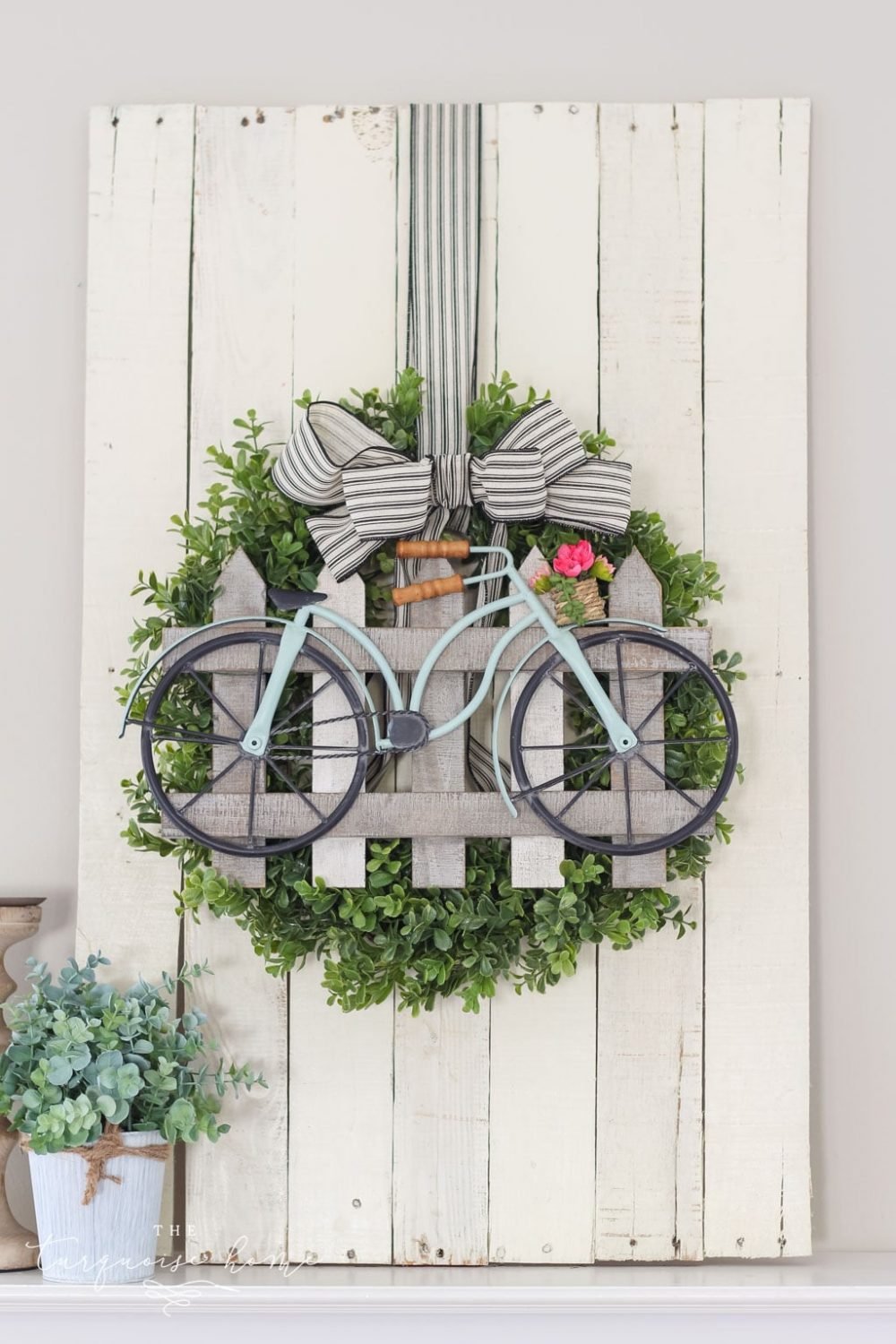 Image of front door wreath with bicycle detail