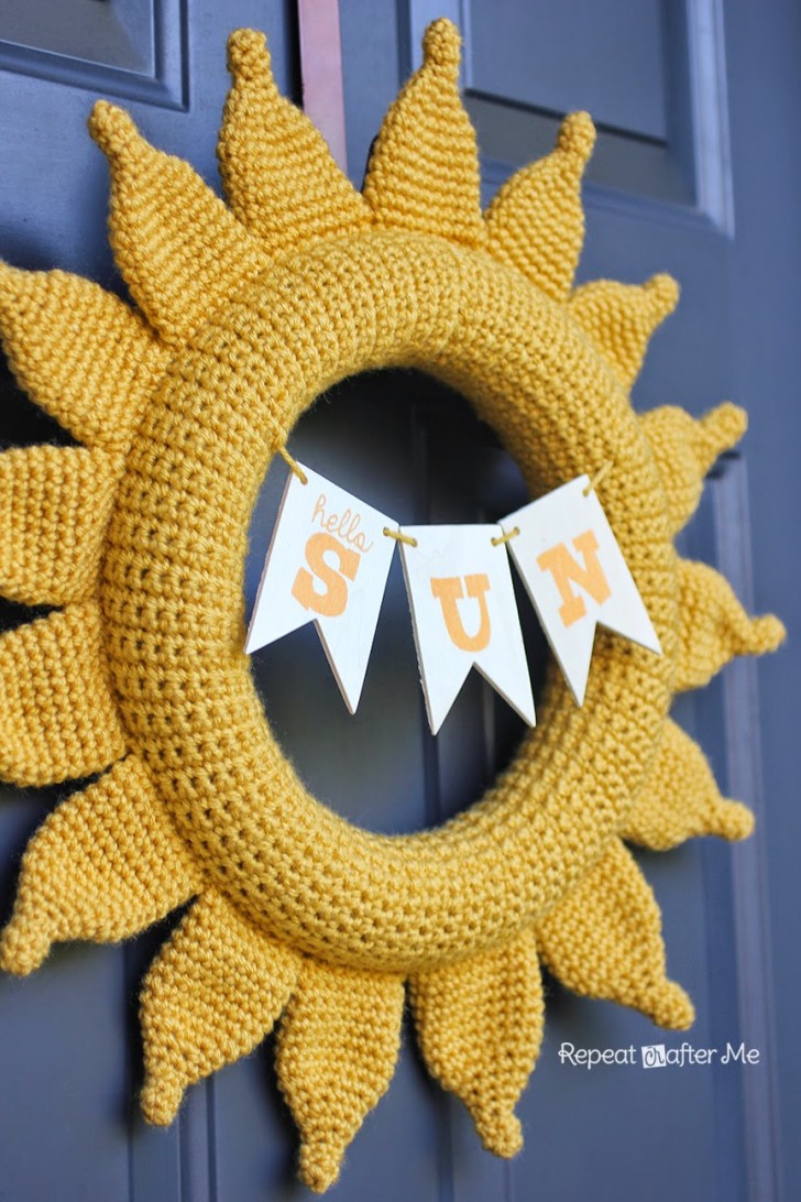 Image of a crochet front door wreath in the shape of the sun