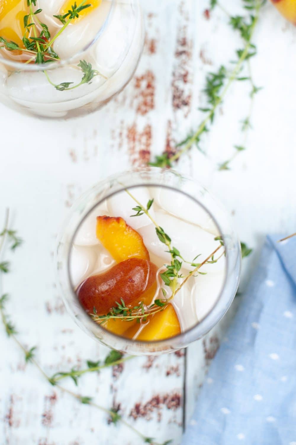 Image of peach cocktail recipe in a glass, shot from the top