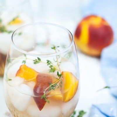 Absolutely delicious PEACH COCKTAIL with peach syrup and thyme