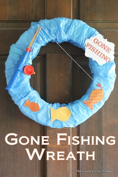 Image of blue front door wreath with a "gone fishing" sign