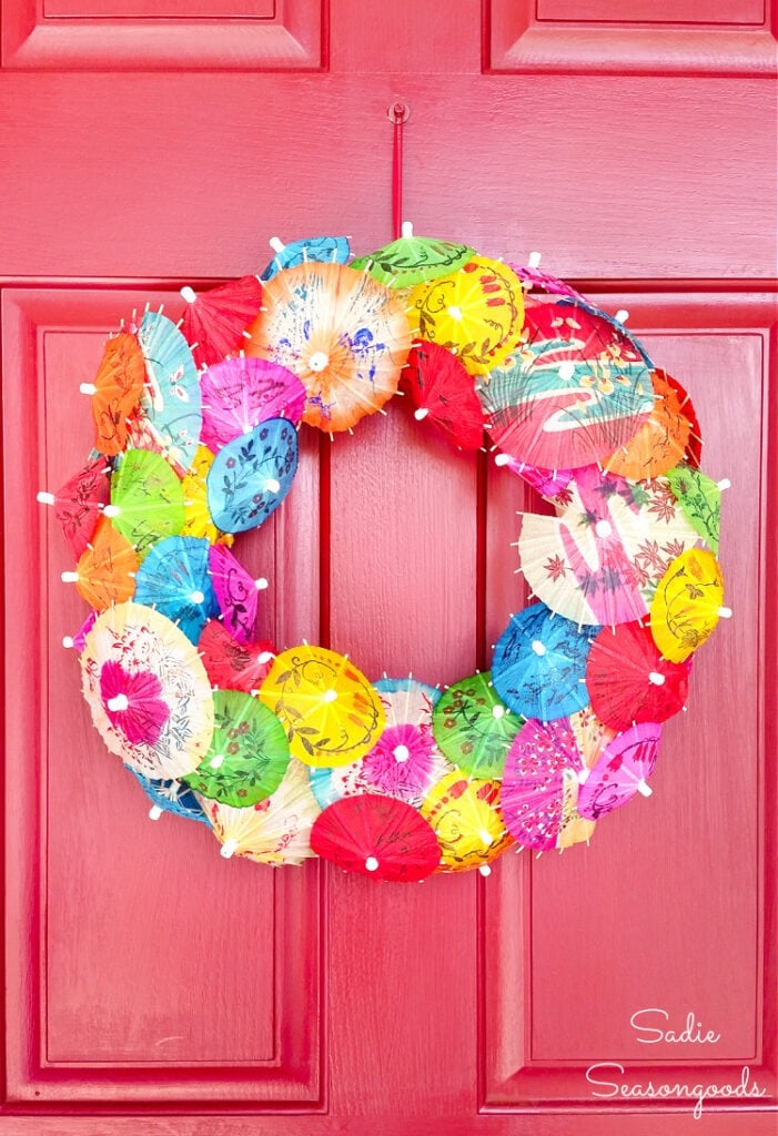 Image of front door wreath made with small umbrellas for drinks