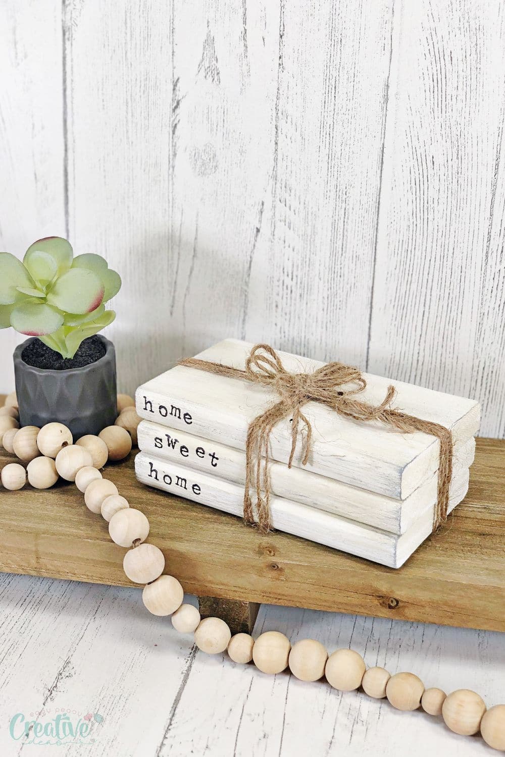 Image of farmhouse style DIY book stacks on a shelf