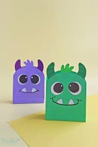 Image of paper Halloween treat bags in green and navy blue