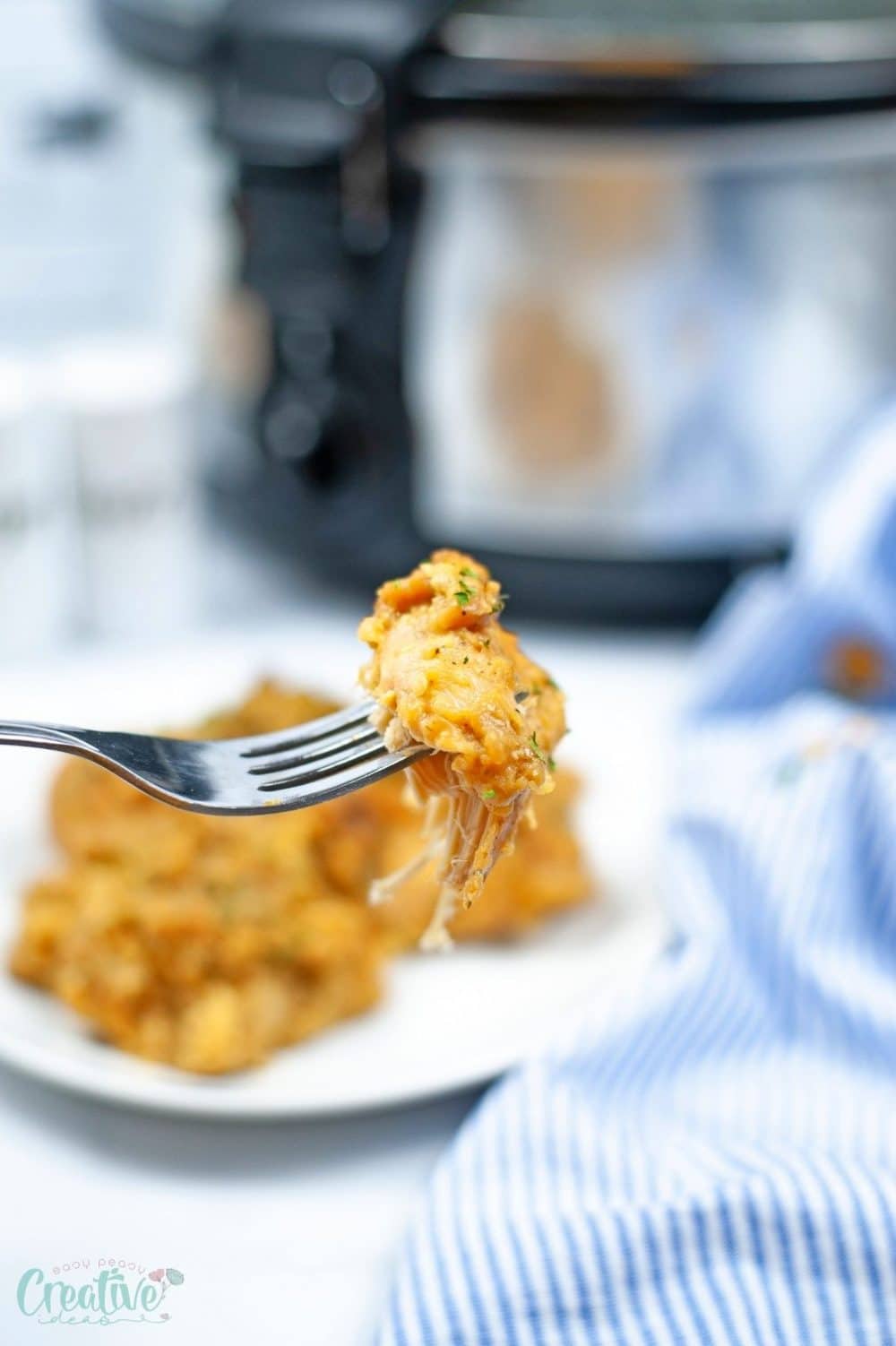 A piece of slow cooker chicken stuffing on a fork