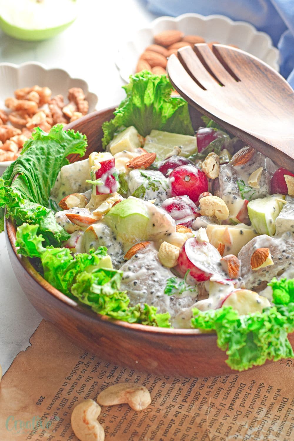 Image of Waldorf fruit salad on a lettuce bed in a brown salad bowl