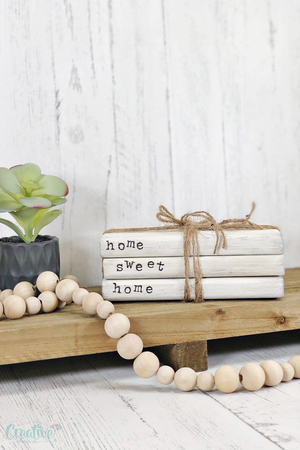 Image of white wood book stacks with letter stamps