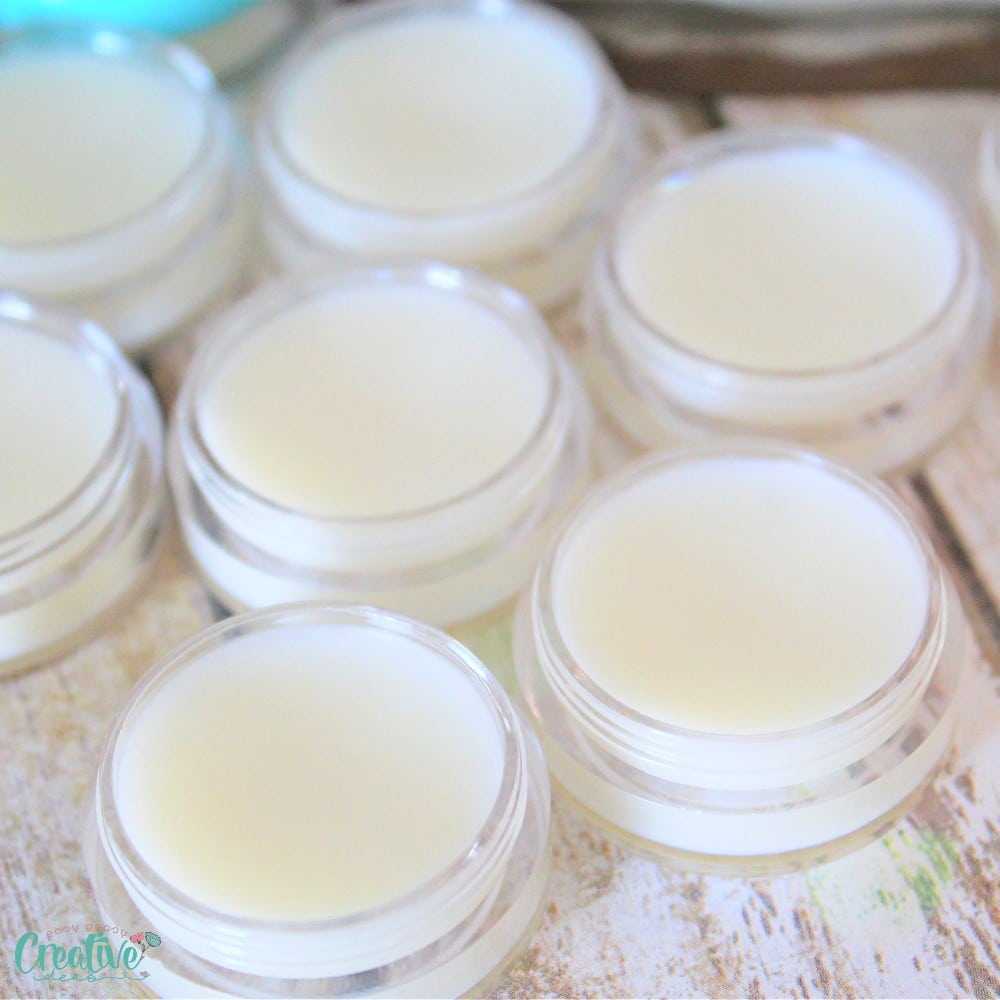 Closeup image of homemade balm for headaches in small jars
