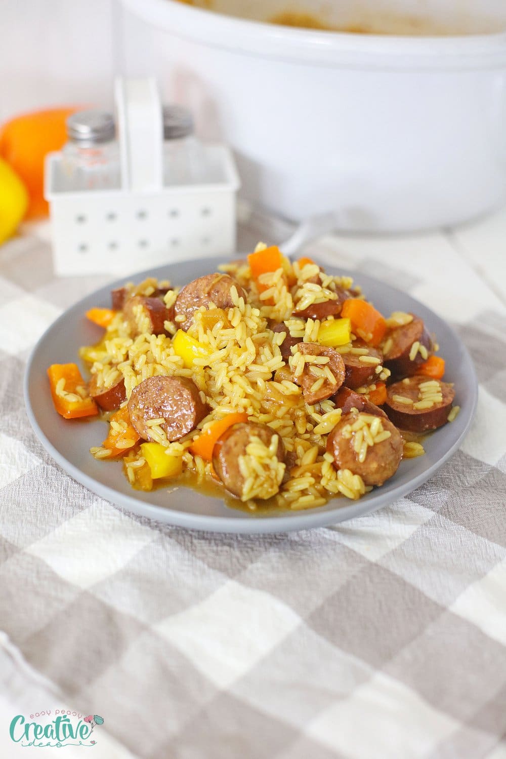 Slow cooker kielbasa in a serving plate on the kitchen table