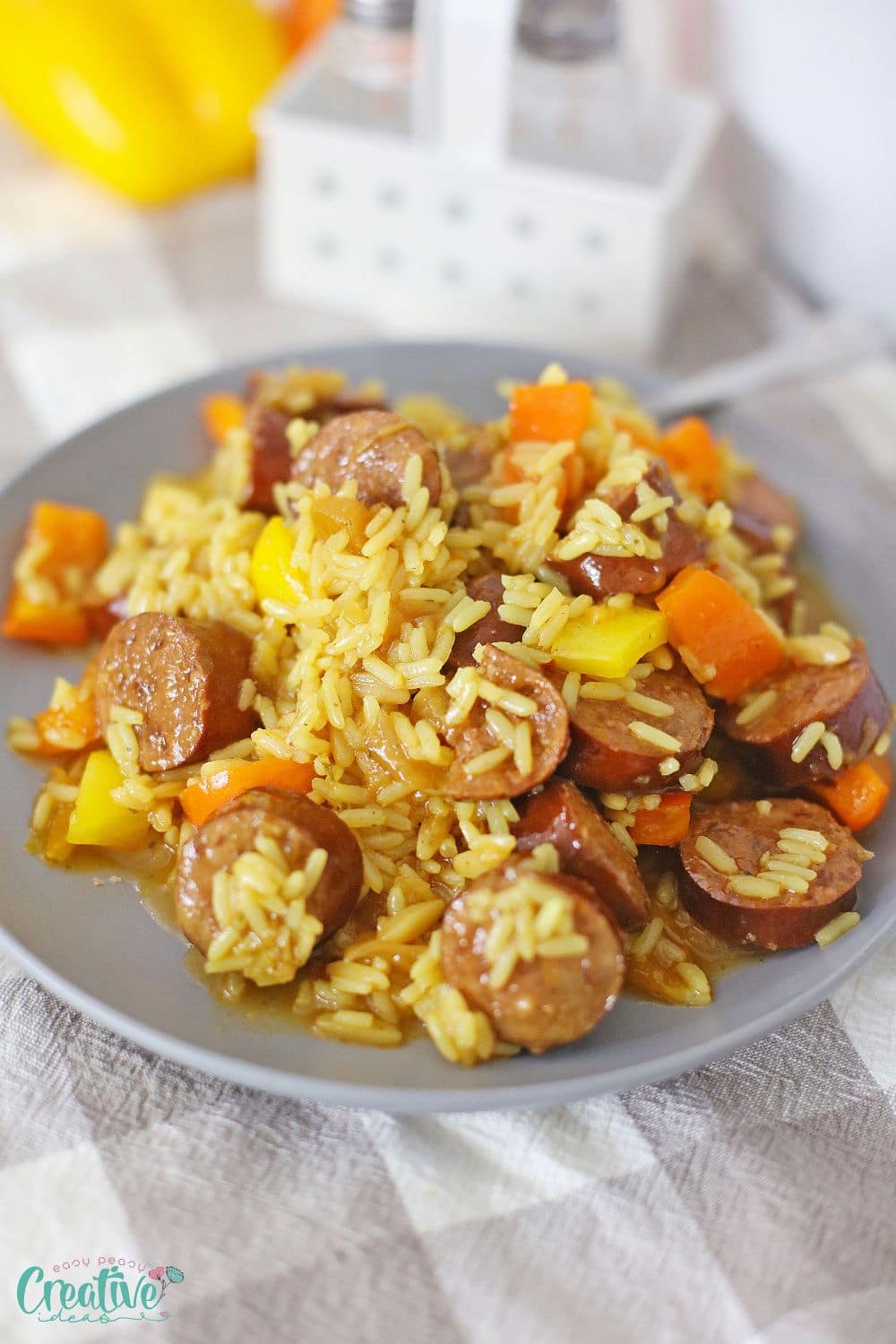 Close up image of sweet and sour kielbasa in a serving plate