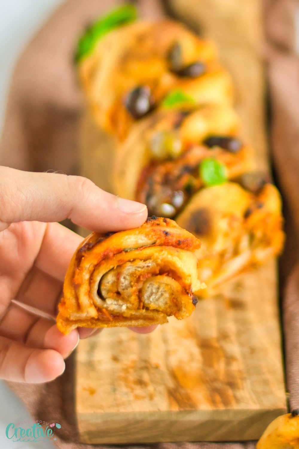 Close up image of a slice of vegan pizza babka