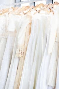 Assortment of different types of dresses for women hanging on a hanger