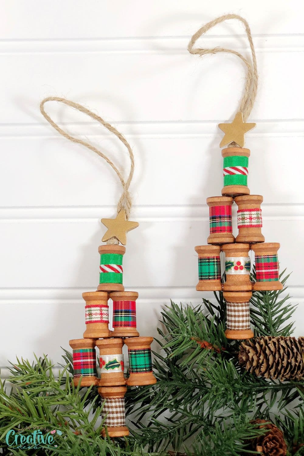DIY wooden spool ornaments in a Christmas tree