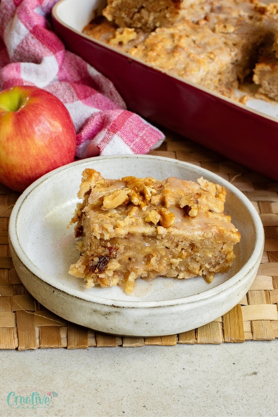 Tasty apple & cinnamon cake recipe featuring a moist cake with apple chunks and cinnamon flavor.
