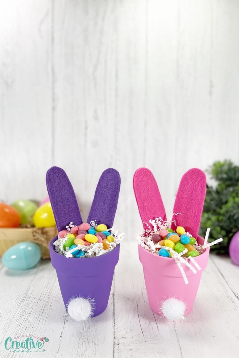Two small clay pots filled with colorful candy, creating a vibrant and sweet Easter display as bunny butts craft.
