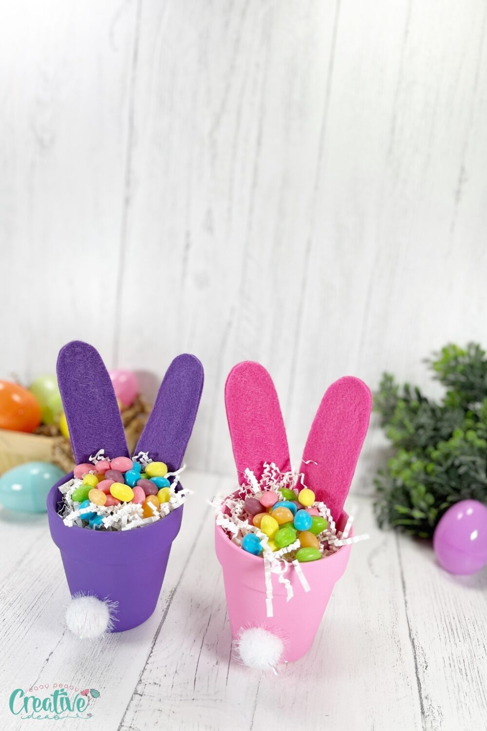 Two colorful Easter bunny butts craft filled with candy, perfect for a sweet celebration