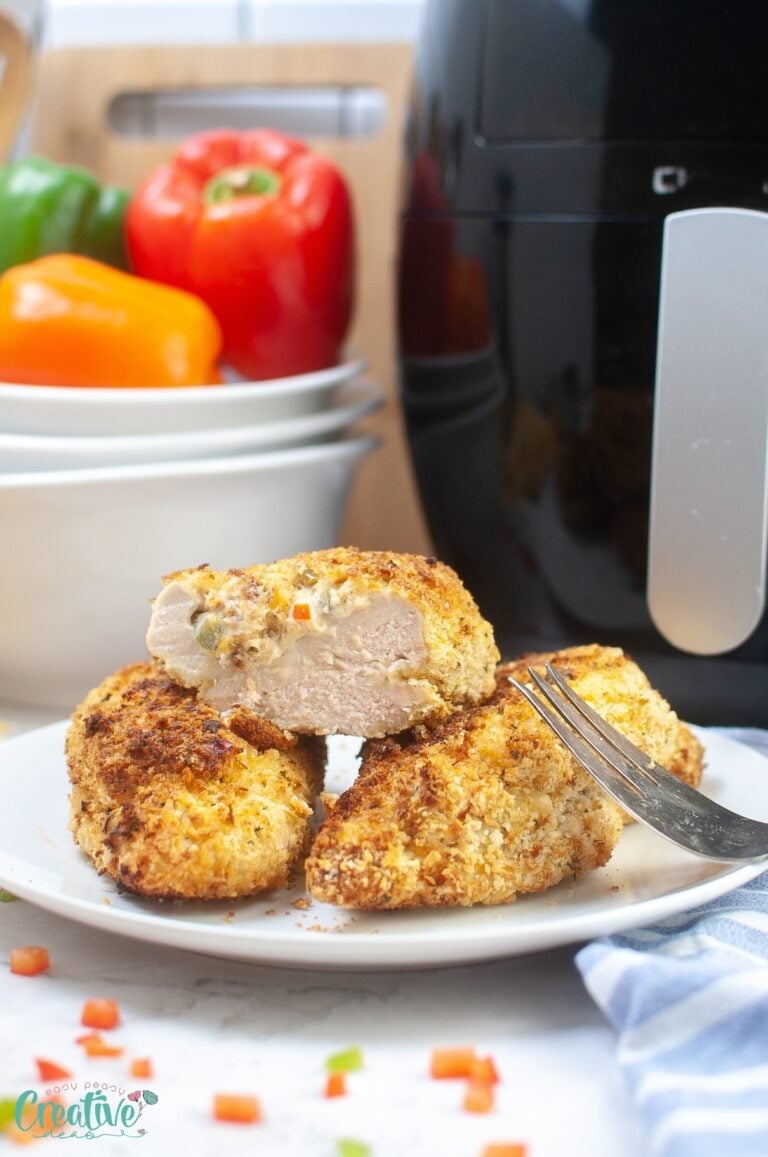 Yummy stuffed chicken breast in air fryer, a delightful dish with moist chicken and a crunchy exterior.