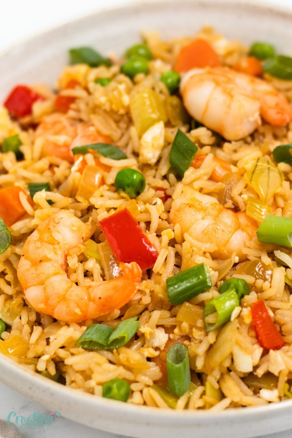 Prepare a delicious Asian shrimp fried rice dish with savory shrimps, fresh veggies, ideal for busy weeknights!