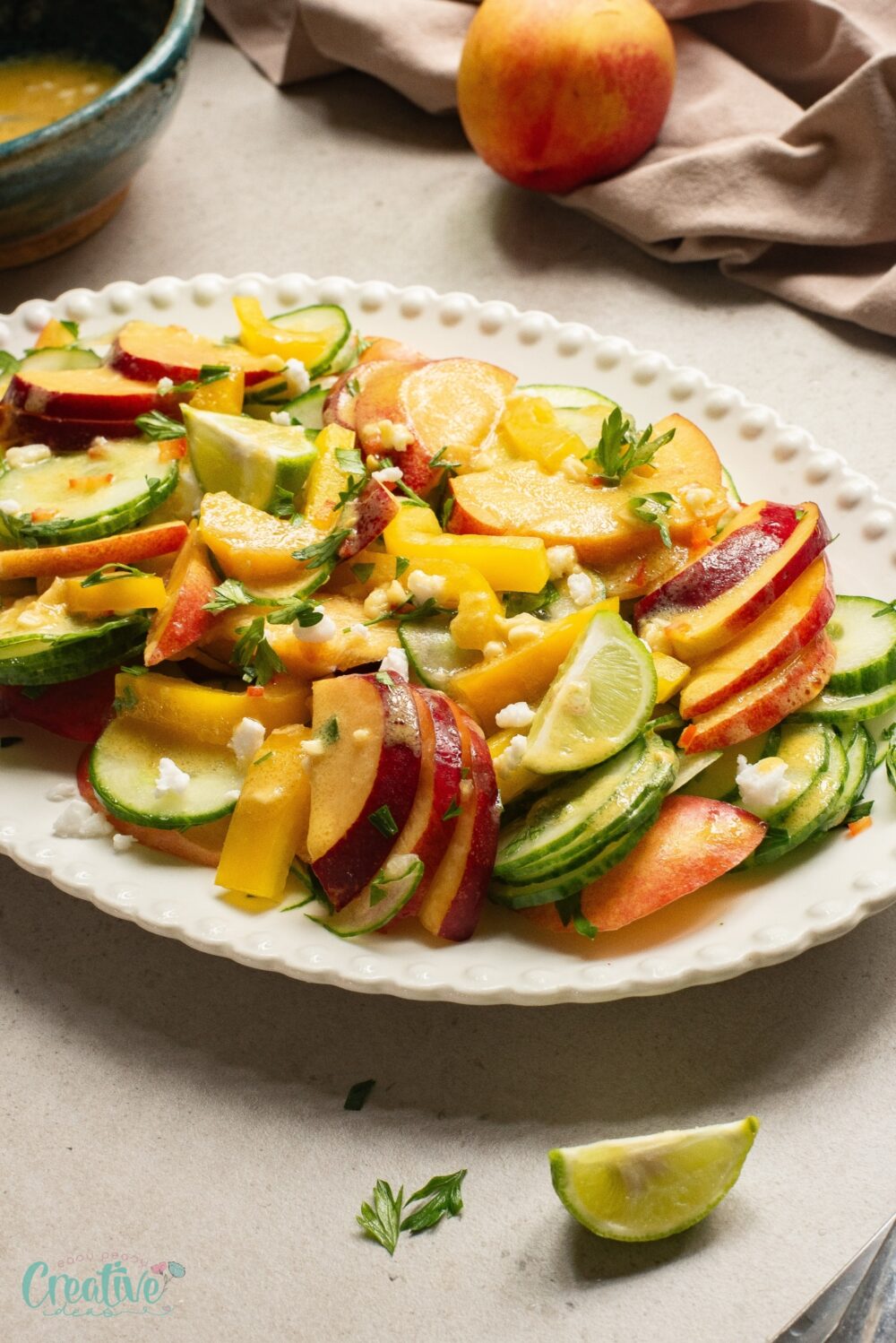 Zesty nectarine and cucumber salad, a versatile dish bursting with vibrant summer flavors.