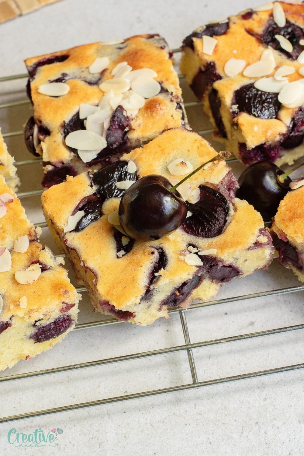 Experience the irresistible allure of easy cherry sheet cake, featuring cherries and almonds, that is sure to please.