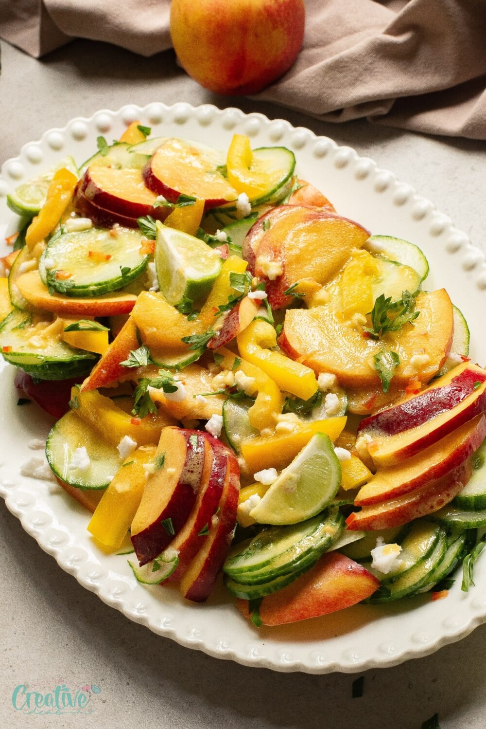 Sliced nectarines and cucumbers accompanied by a delicious dressing, a simple and flavorful nectarine salad.