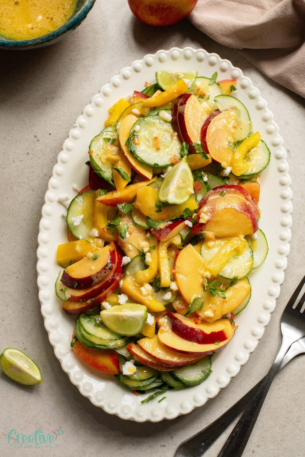 Fresh nectarine and cucumber salad with zesty dressing, perfect for a burst of energy and vitamins.