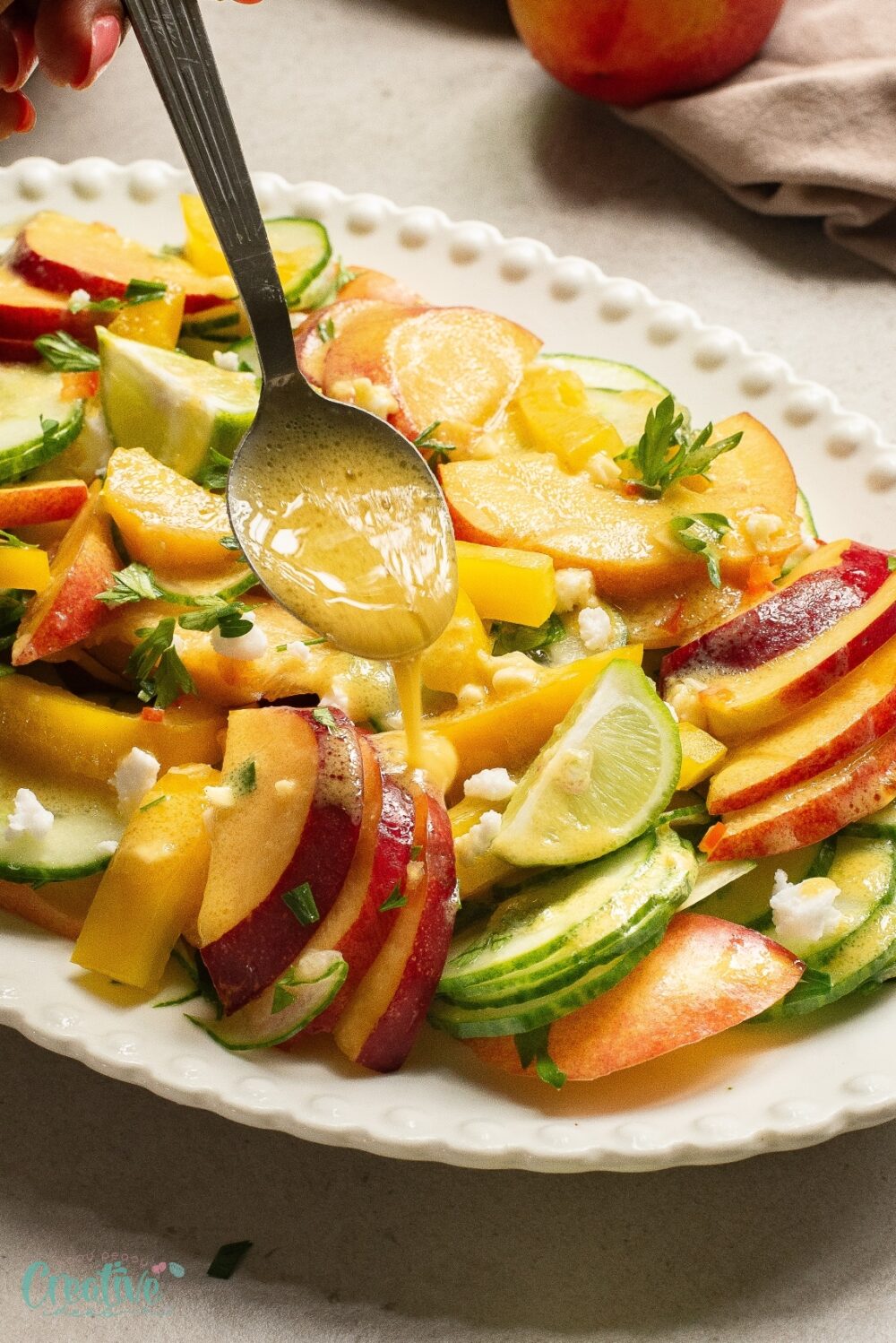Customize your meal with a refreshing nectarine salad including cucumber slices and nectarine wedges.