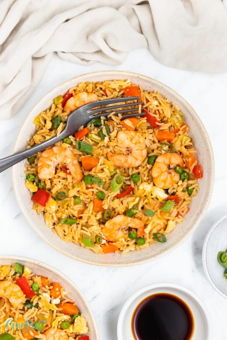 Whip up savory shrimp fried rice with fresh veggies, perfect for quick weeknight dinners!