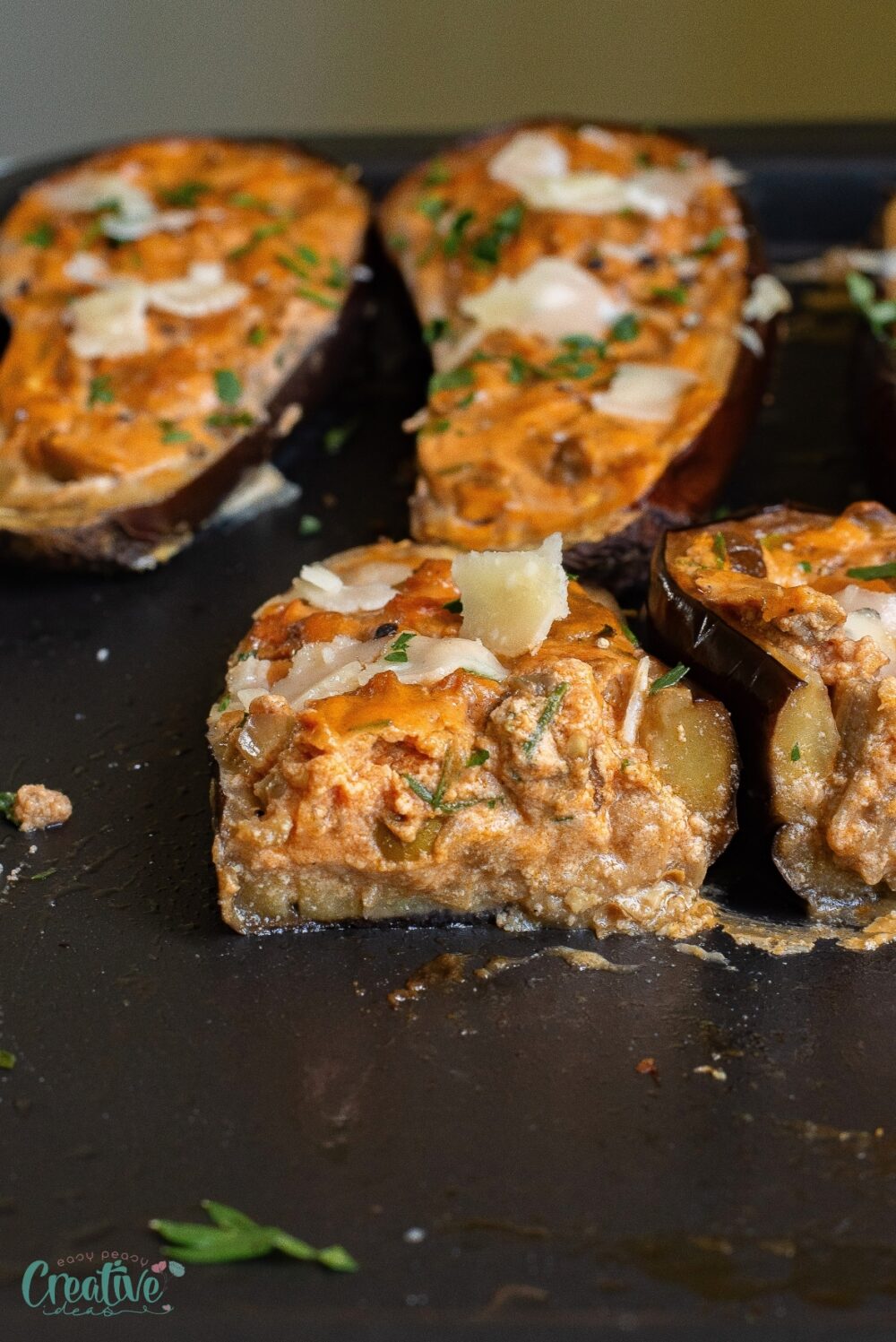 Delicious vegetarian stuffed aubergine filled with cheese, veggies, spices - a quick, nourishing, and healthy delight!