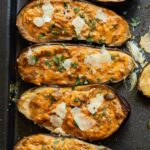 A mouthwatering vegetarian stuffed eggplant: cheese-filled, seasoned with flavorful spices, and packed with wholesome goodness. A delicious and healthy delight!