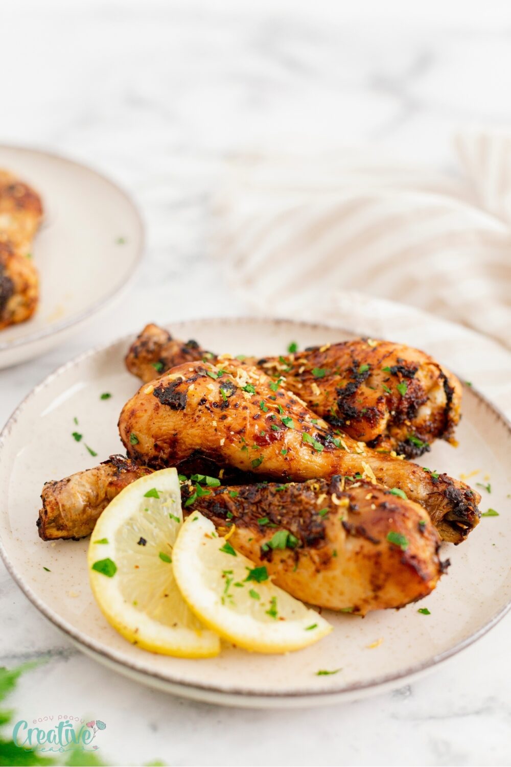 Delicious baked lemon chicken drumsticks - a perfect blend of zesty lemon and heartwarming chicken goodness!