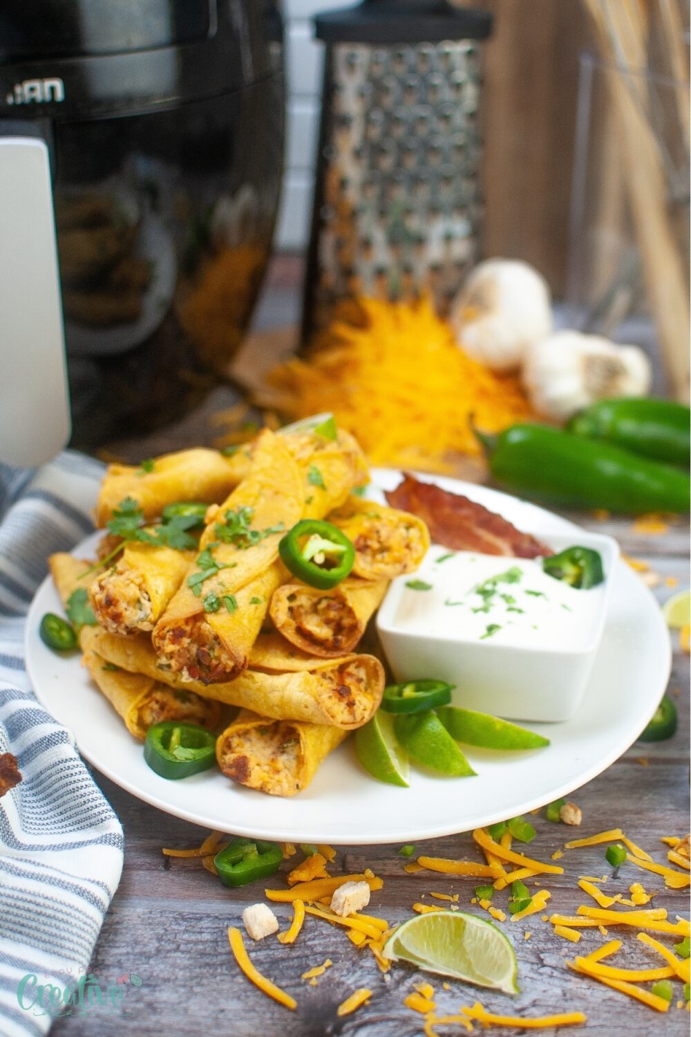 Delight in the spicy fusion of creamy cheese and tangy jalapenos in these baked taquitos.